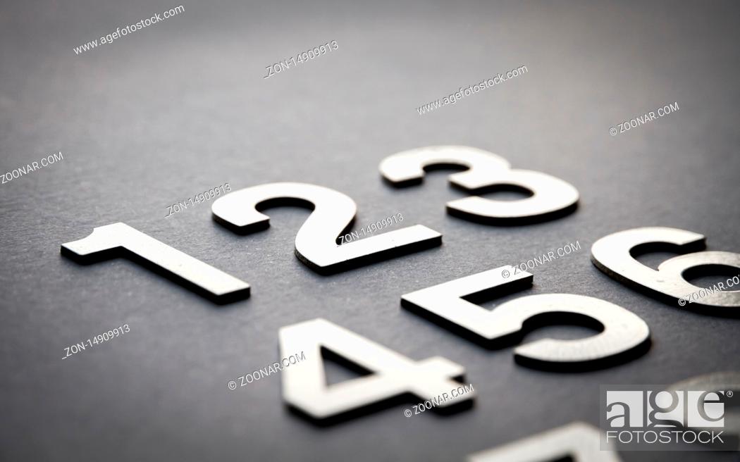 Stock Photo: Mathematics background made with solid numbers from 1 to 9 - Closeup view.
