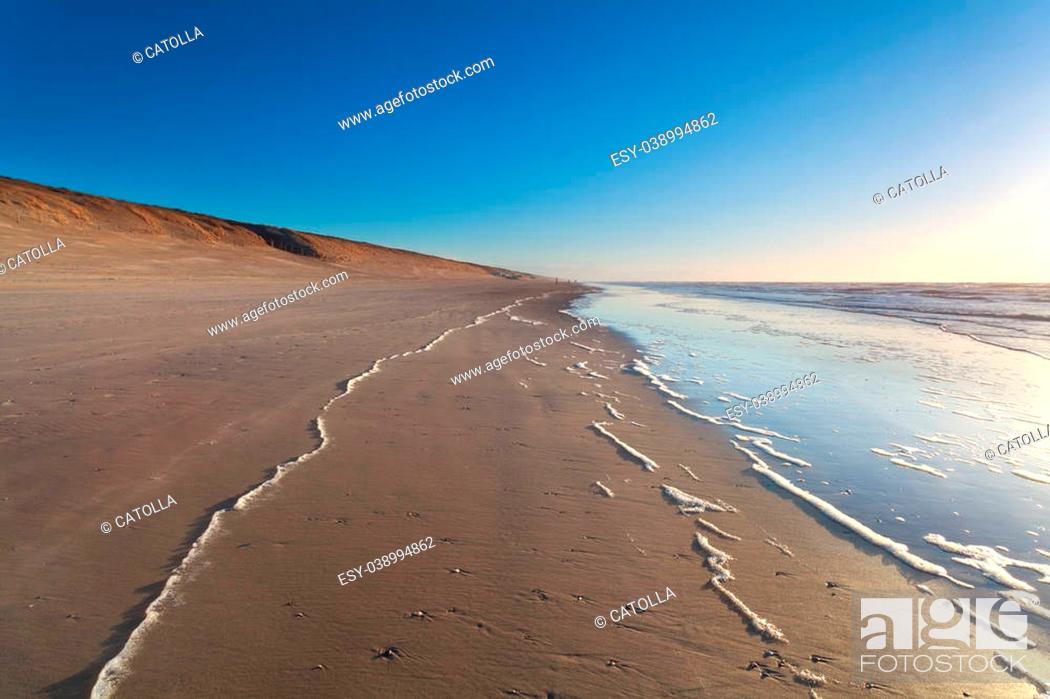 Stock Photo: sand beach and North sea waves, Holland.