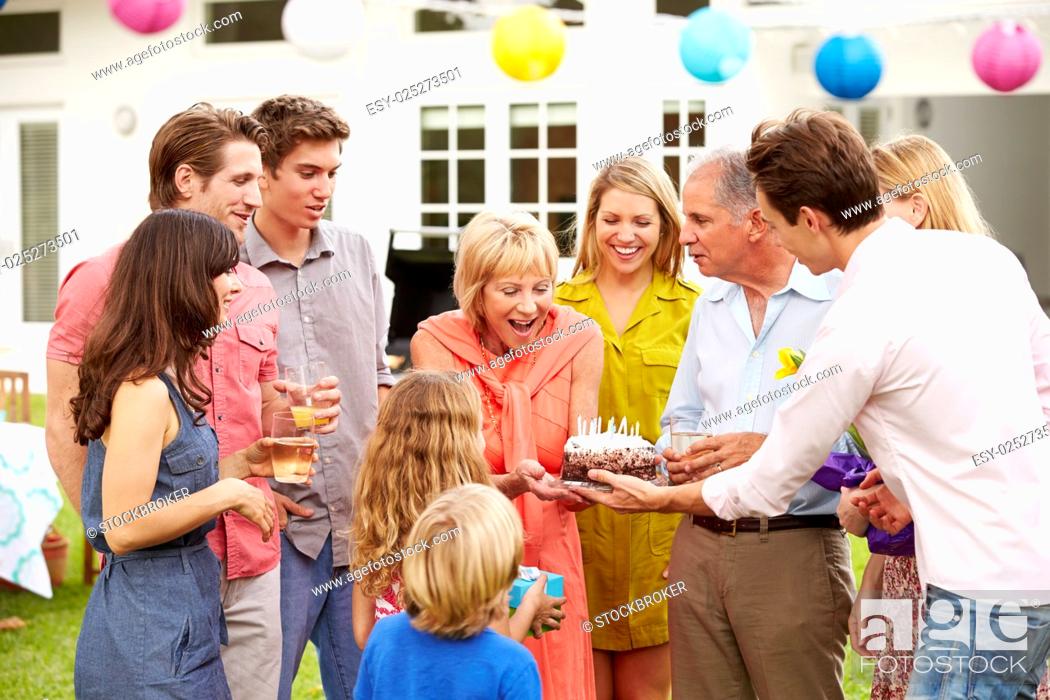 Stock Photo: Multi Generation Family Celebrating Birthday In Garden.