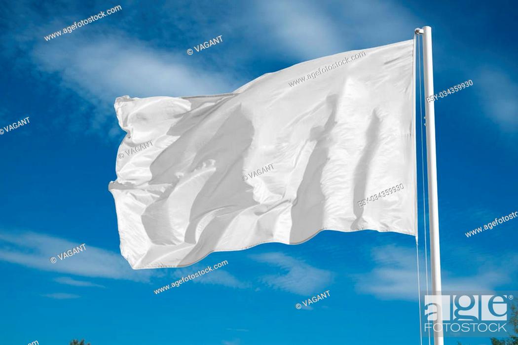 Stock Photo: blank white flying flag on a clear sky.