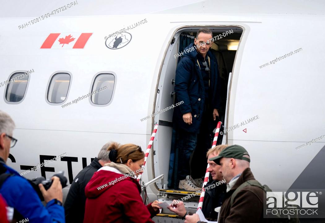 Stock Photo: 15 August 2019, Canada, Iqaluit: Heiko Maas (SPD), Foreign Minister, is standing in the door of a charter plane before flying to Pond Inlet in the Canadian.