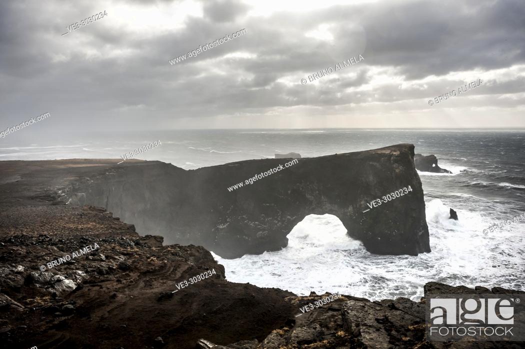 Stock Photo: Arch and cliffs in Dyrhólaey (region of Suðurland, Iceland).
