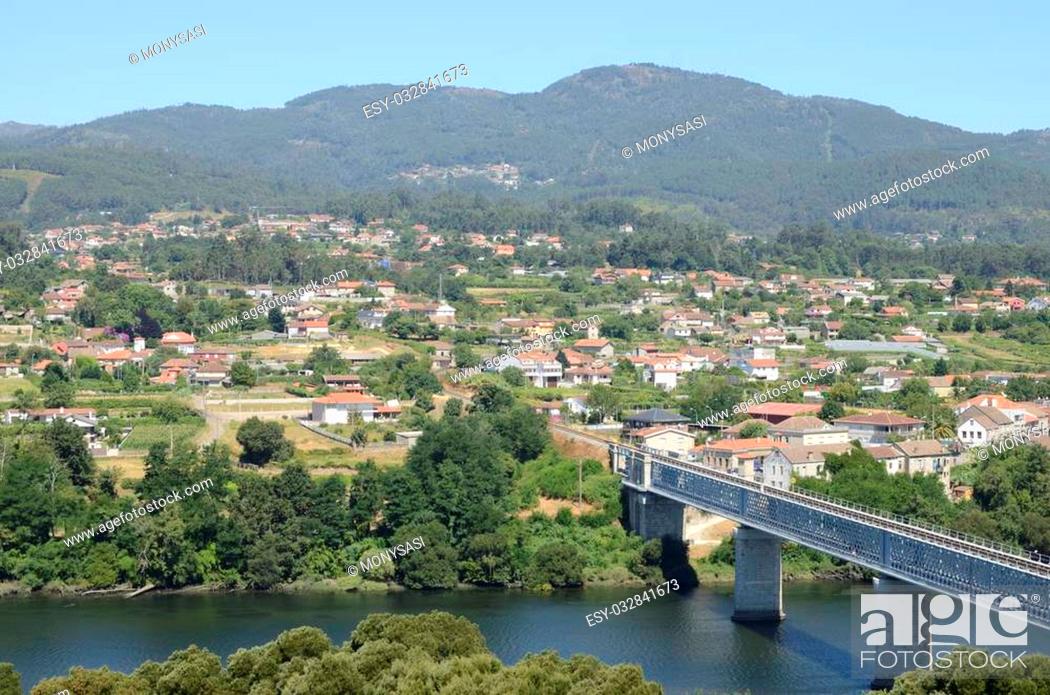 Stock Photo: View of the Spanish town of Tuy and the river Minho seen from Valenca in Portugal. The bridge connect both towns.