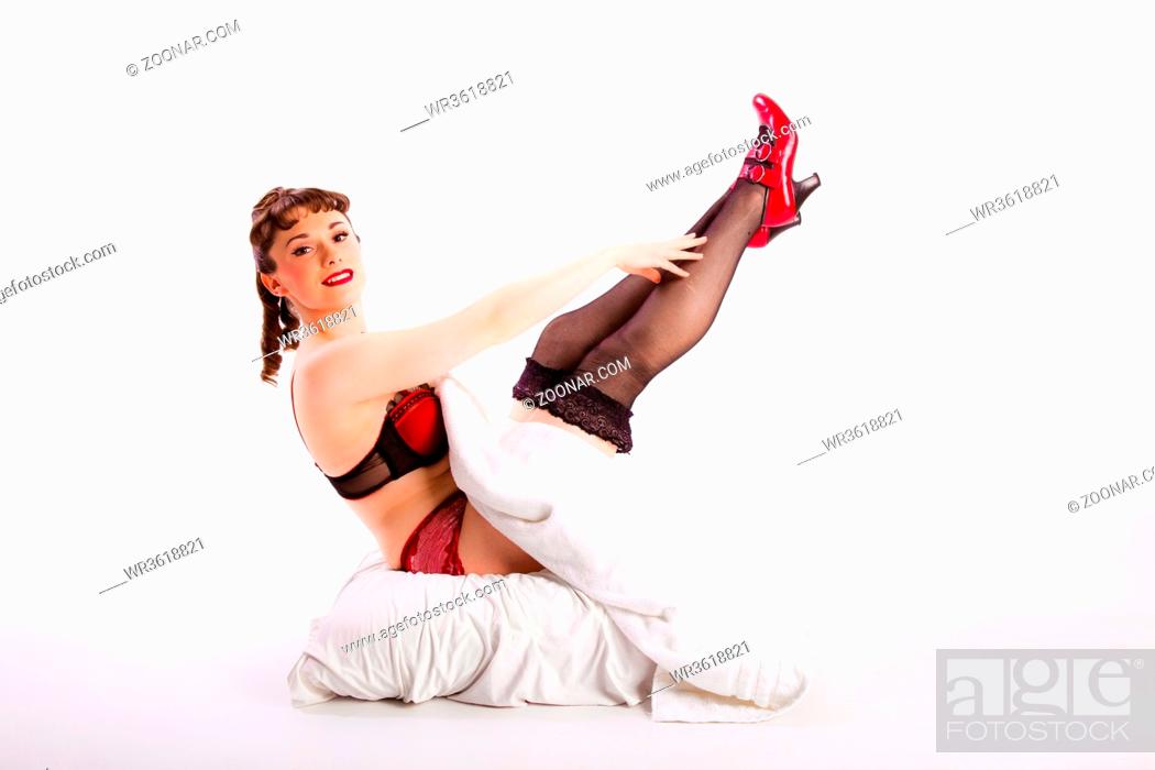 Photo de stock: young girl in fifties pin-up style wearing lingerie.