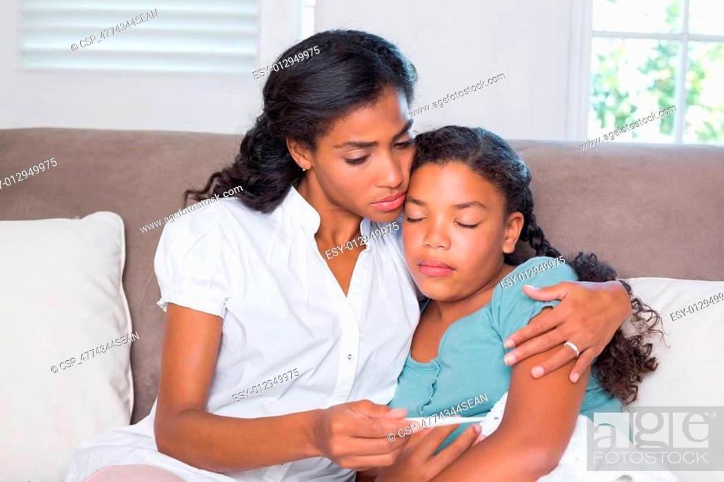 Stock Photo: Concerned mother taking her daughte.