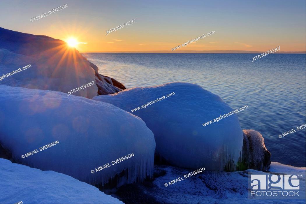 Stock Photo: Sunset over lake in winter.