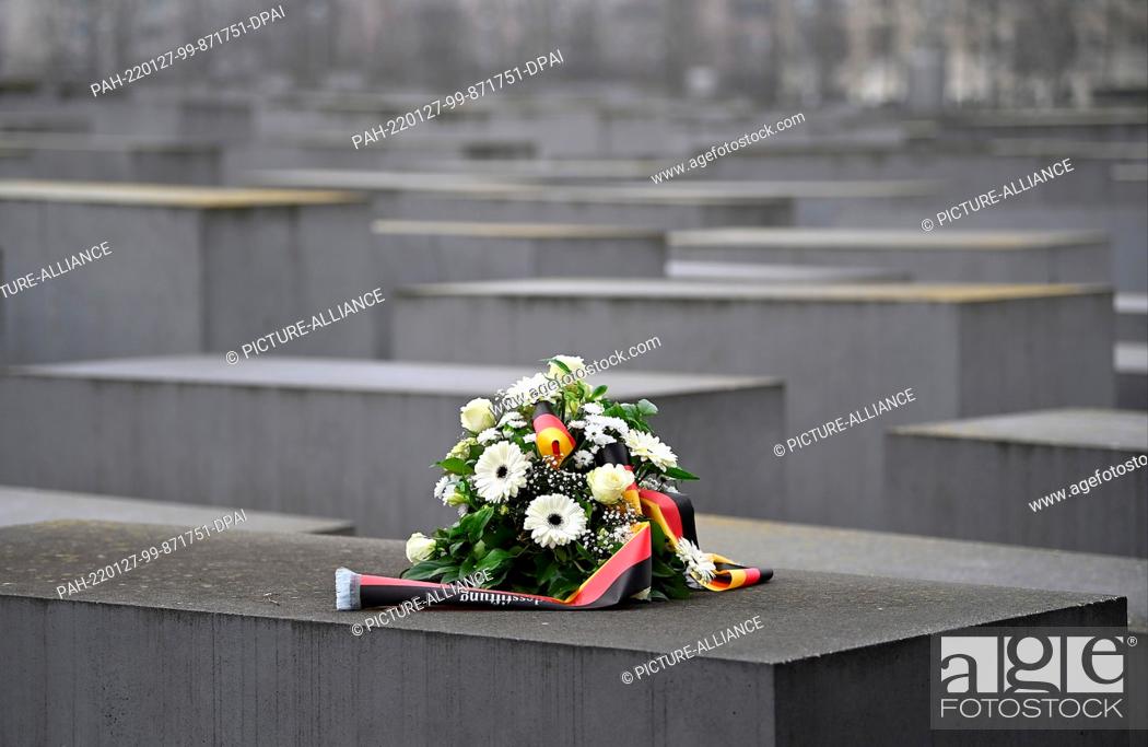 Stock Photo: 27 January 2022, Berlin: A memorial wreath lies at the Memorial to the Murdered Jews of Europe, also called the Holocaust Memorial.