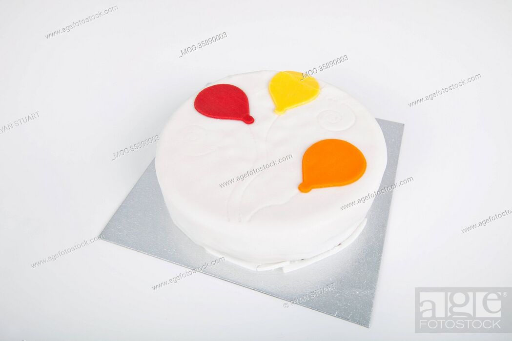 Stock Photo: High angle view of birthday cake over white background.