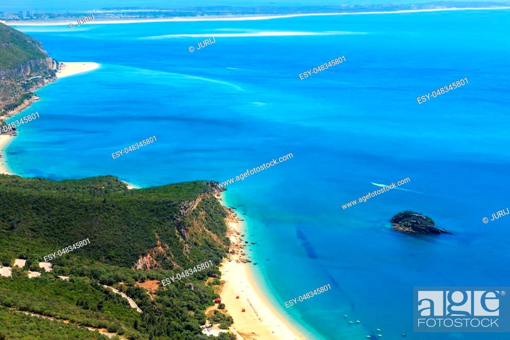 Stock Photo: Summer sea coastal landscape with sandy Portinho beach. Top view from Nature Park of Arrabida in Setubal, Portugal. All peoples unrecognizable.