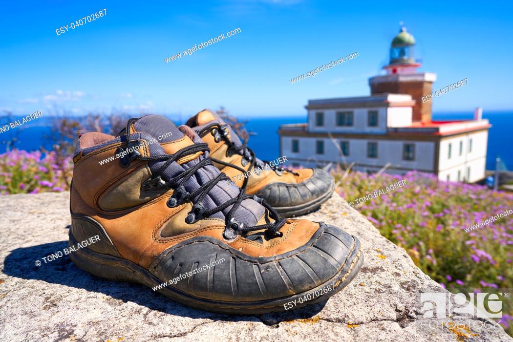 Stock Photo: Used boots shoes at the end of Saint James Way in Finisterre Fisterra Camino de Santiago Spain.