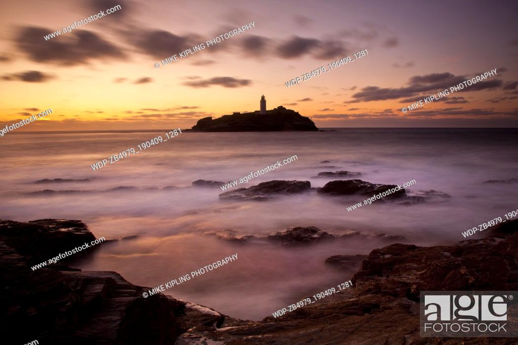Stock Photo: High Tide at Sunset, Godrevy Point and Lighthouse, St Ives Bay, North Cornwall.