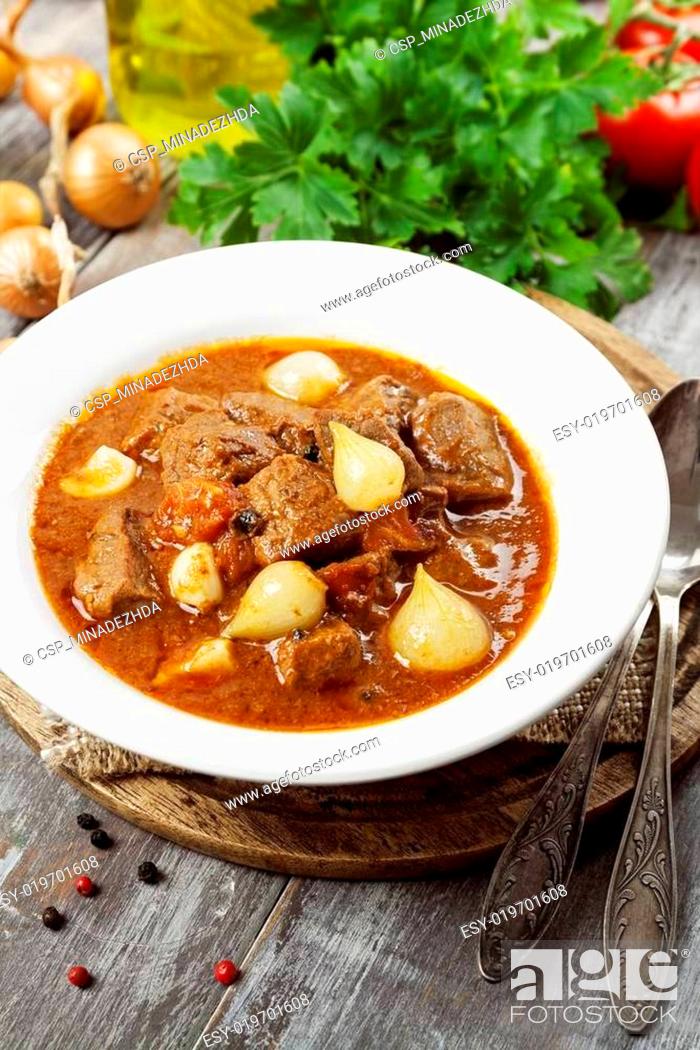 Stock Photo: Stewed beef with onions and tomatoes, stifado.