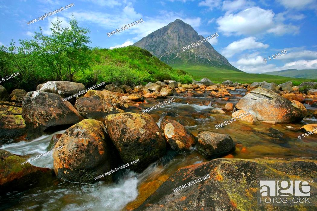 Stock Photo: Buachaille Etive Mor and riverbed of Coupal river at low water level with red rocks and boulders visible, United Kingdom, Scotland, Highlands, Glen Etive.