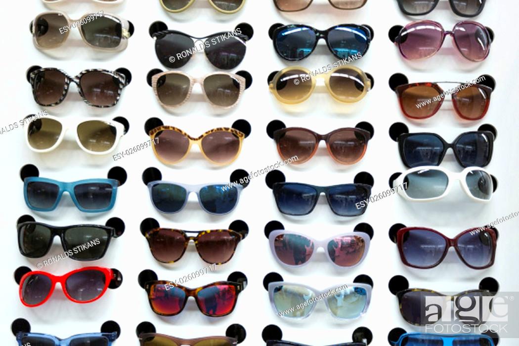 Stock Photo: rack with sunglasses in eyewear store.