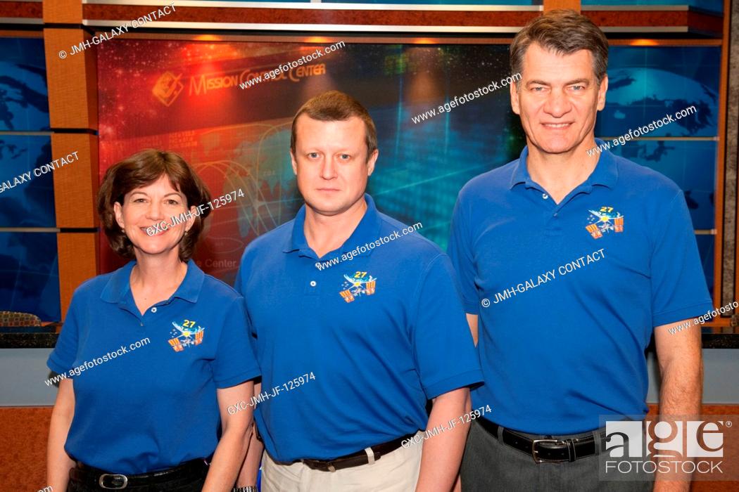 Stock Photo: Russian cosmonaut Dmitry Kondratyev (center), Expedition 26 flight engineer and Expedition 27 commander; along with NASA astronaut Catherine Coleman and.