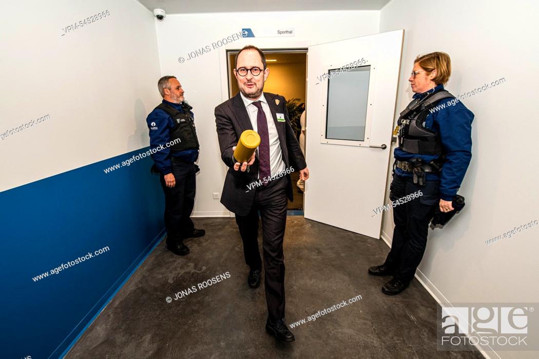Stock Photo: Justice Minister Vincent Van Quickenborne jokingly tosses his waterbottle at the photographer during the inauguration of the new Dendermonde Prison.