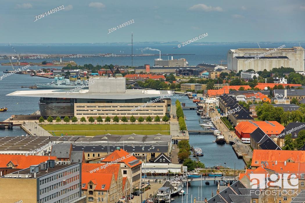 Stock Photo: Skyline of scandinavian city of Copenhagen in Denmark during a cloudy day.