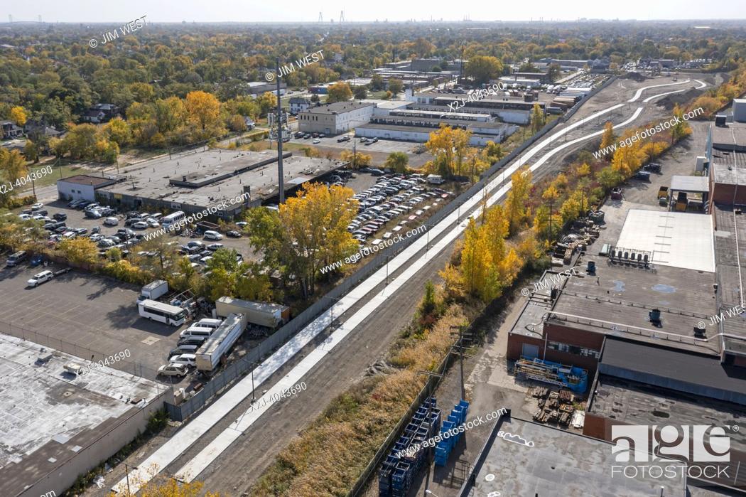 Stock Photo: Detroit, Michigan USA - 14 October 2022 - Work continues on the Joe Louis Greenway, a 27. 5-mile bicycle/walking trail that will circle much of the city and.