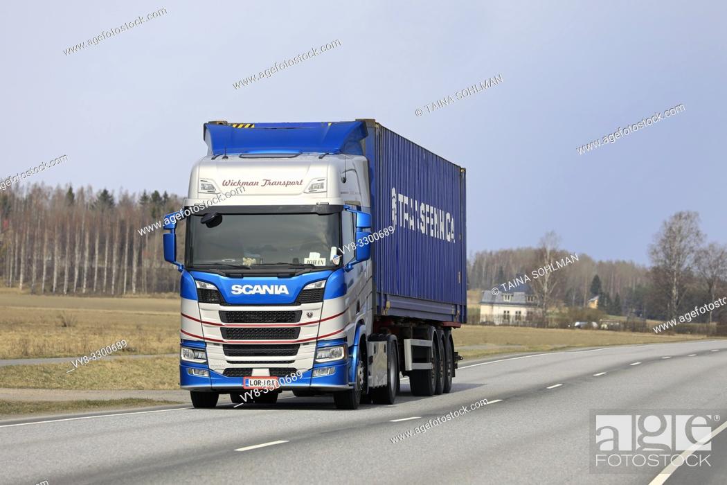 Stock Photo: Salo, Finland - April 18, 2019: Customised Next generation Scania R410 semi trailer of Transport P Wickman hauls goods along highway in the spring.