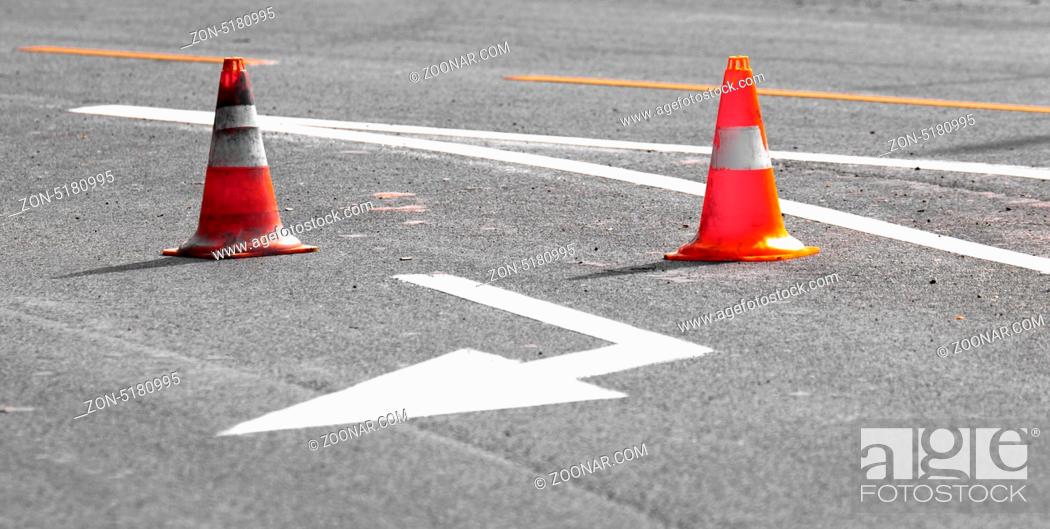 Stock Photo: Road block with white arrow showing the alternate way.