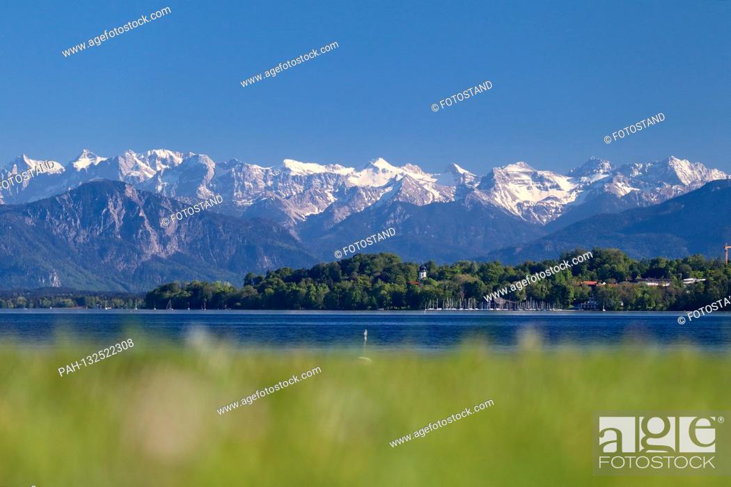 Stock Photo: District of Starnberg, Germany May 09, 2020: Impressions Starnberger See - 2020 Tutzing, Brahmspromenade, Starnberger See with a view of Bernried.