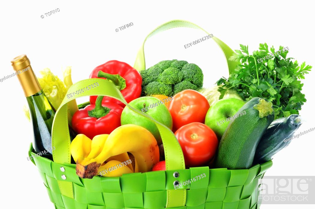 Stock Photo: Green shopping bag with groceries isolated on white background.