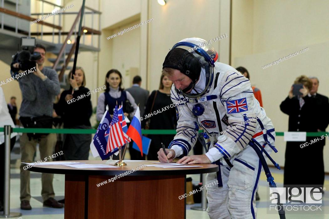 Stock Photo: At the Gagarin Cosmonaut Training Center in Star City, Russia, Expedition 46-47 crewmember Tim Peake of the European Space Agency signs in for his qualification.