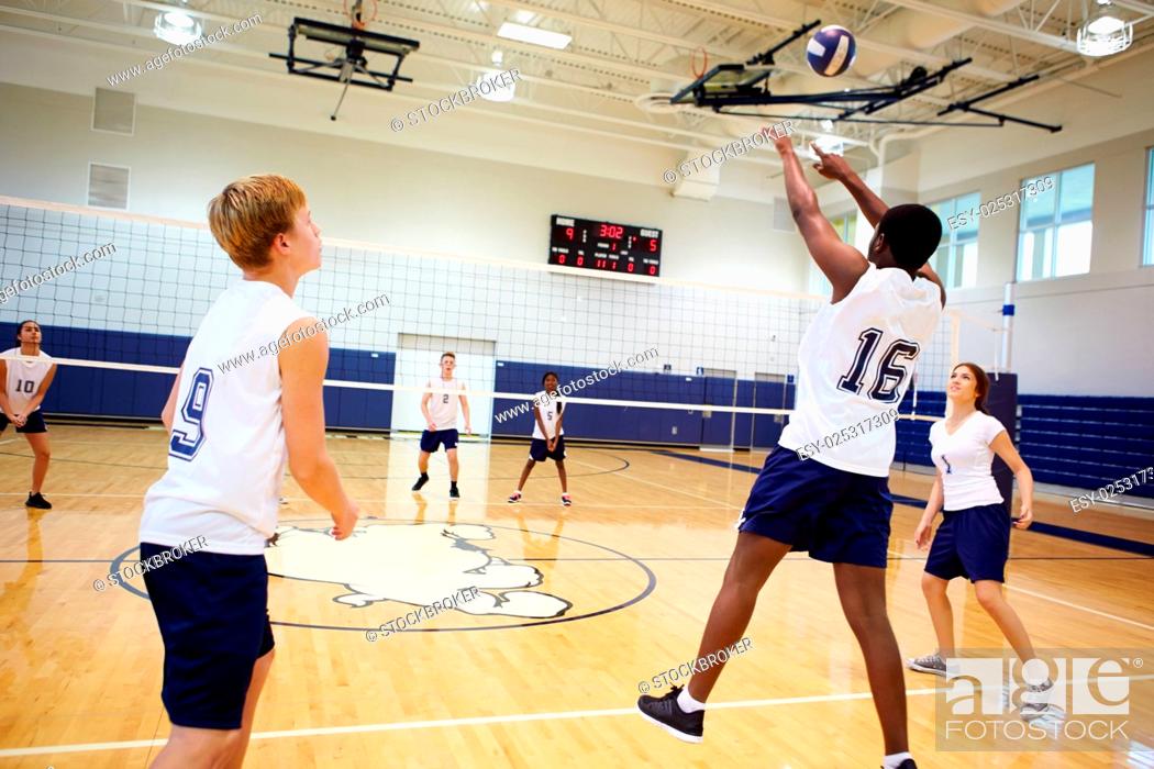 Stock Photo: High School Volleyball Match In Gymnasium.
