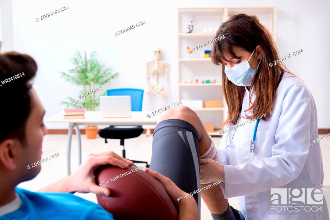 Stock Photo: American football player with injury visiting doctor.