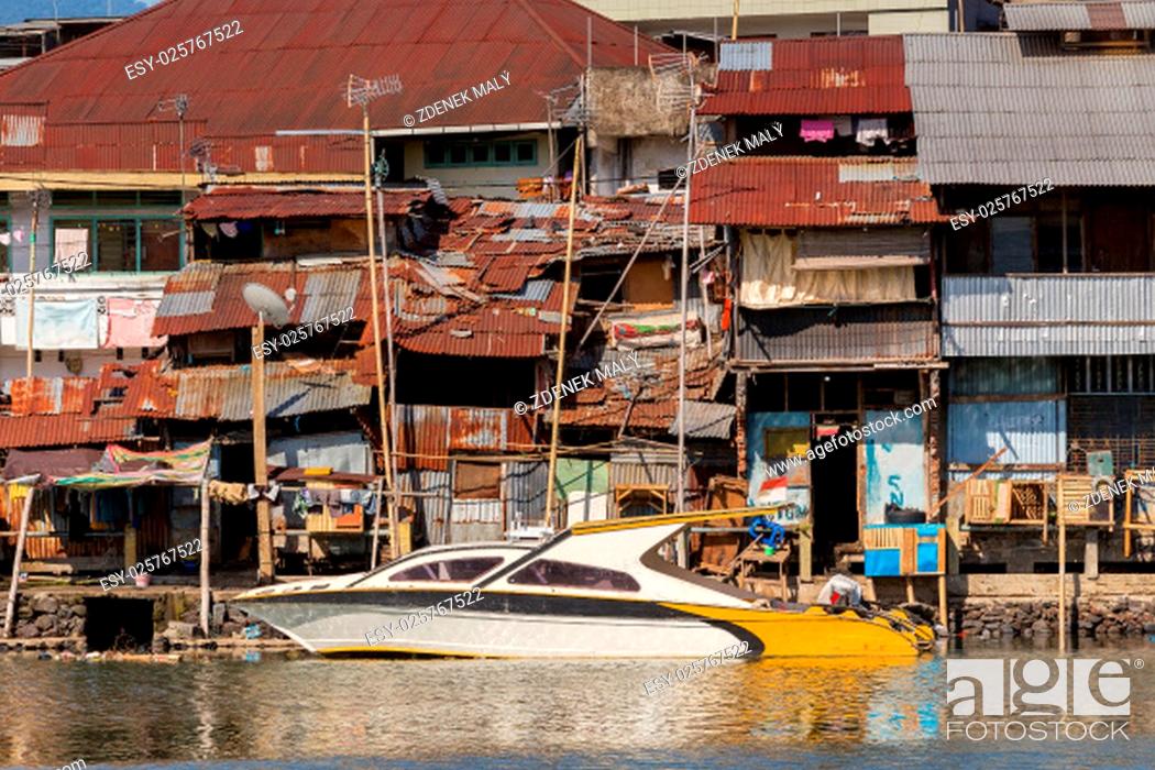Stock Photo: poor houses with sheet tin by the river, Kota Manado, North Sulawesi, Indonesia.