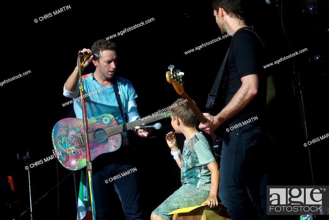 Stock Photo: Singer Chris Martin and bassist Guy Berryman, members of Coldplay, in concert at San Siro Stadium during the Head Full of Dreams Tour. Milan, Italy.