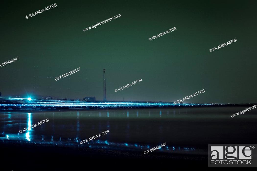 Stock Photo: Night view of an industrial zone  Fireplace and lights  Movement  Slow exposure.
