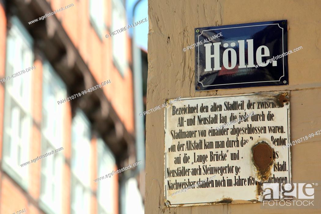 Stock Photo: 18 July 2021, Saxony-Anhalt, Quedlinburg: A street sign with the inscription ""Hell"" in attached to a house facade. Quedlinburg received its town charter in.