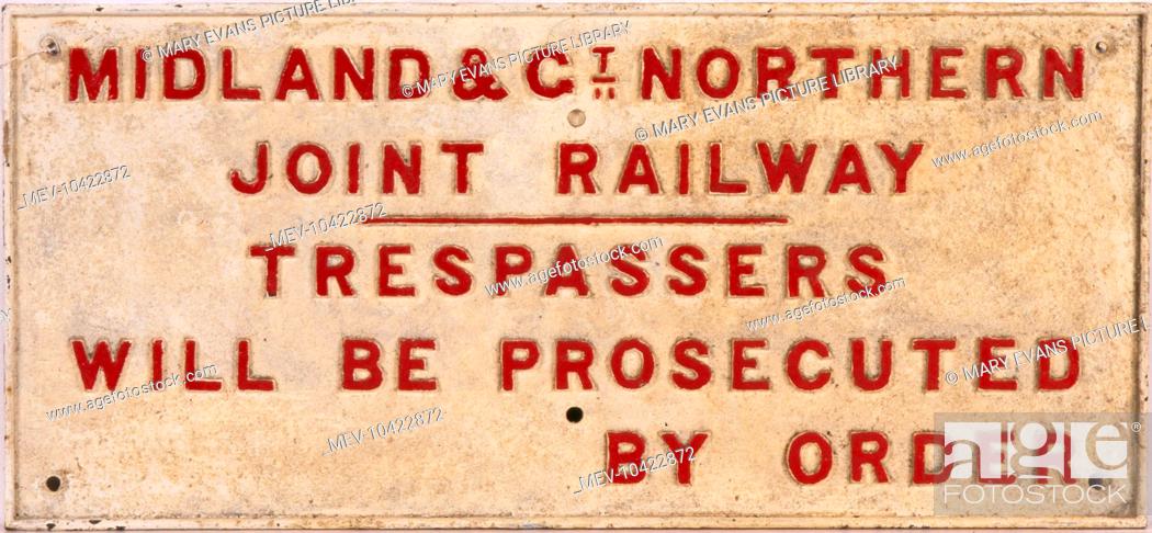 Stock Photo: Midland and Great Northern Joint Railway - Trespassers will be Prosecuted by order - Railway trackside warning sign.