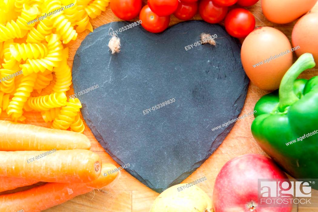 Stock Photo: Food groups, natural healthy fruit and vegatables with a heart shape.