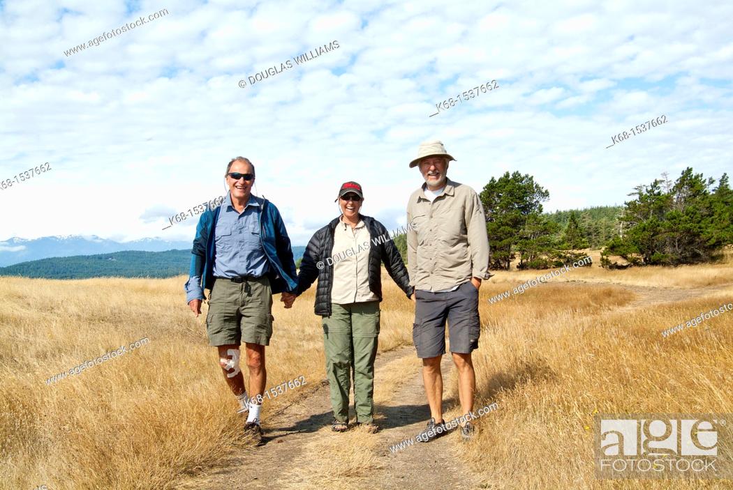 Stock Photo: walkers at Helliwell Park, Hornby Island, Gulf Islands, BC, Canada.