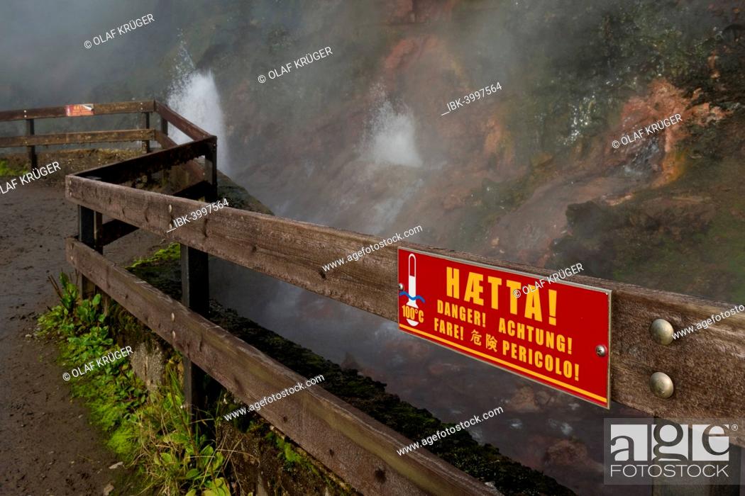 Stock Photo: Warning sign on a fence, hot spring Deildartunguhver, highest-flow hot spring of Iceland with 180 liters of boiling water per second, Reykholtsdalur, Iceland.