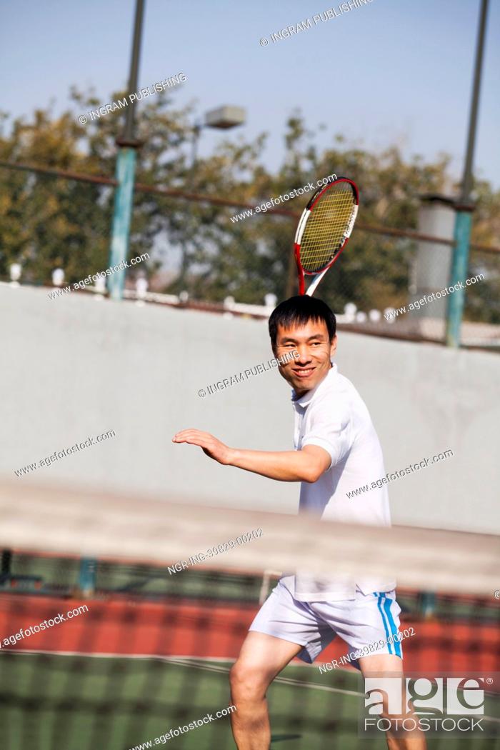 Stock Photo: Adult men playing tennis.