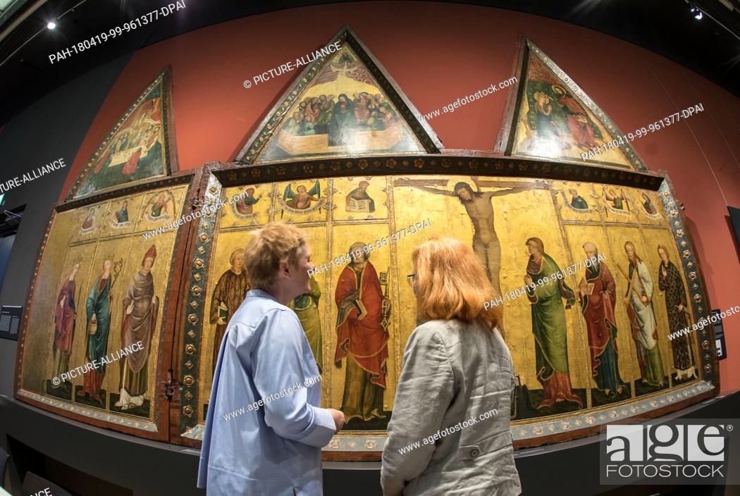 Stock Photo: 19 April 2018, Darmstadt, Germany: Two members of staff are at the press preview of the exhibition ""Nature of the sky"" in the Hessian State Museum Darmstadt.