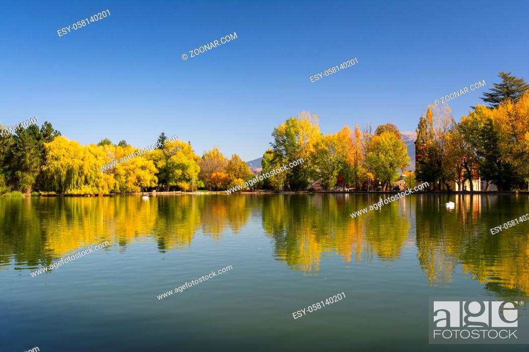 Stock Photo: Autumn colors and reflection on Puigcerda's pond in Pyrenees. Located in north Catalonia, Spain.
