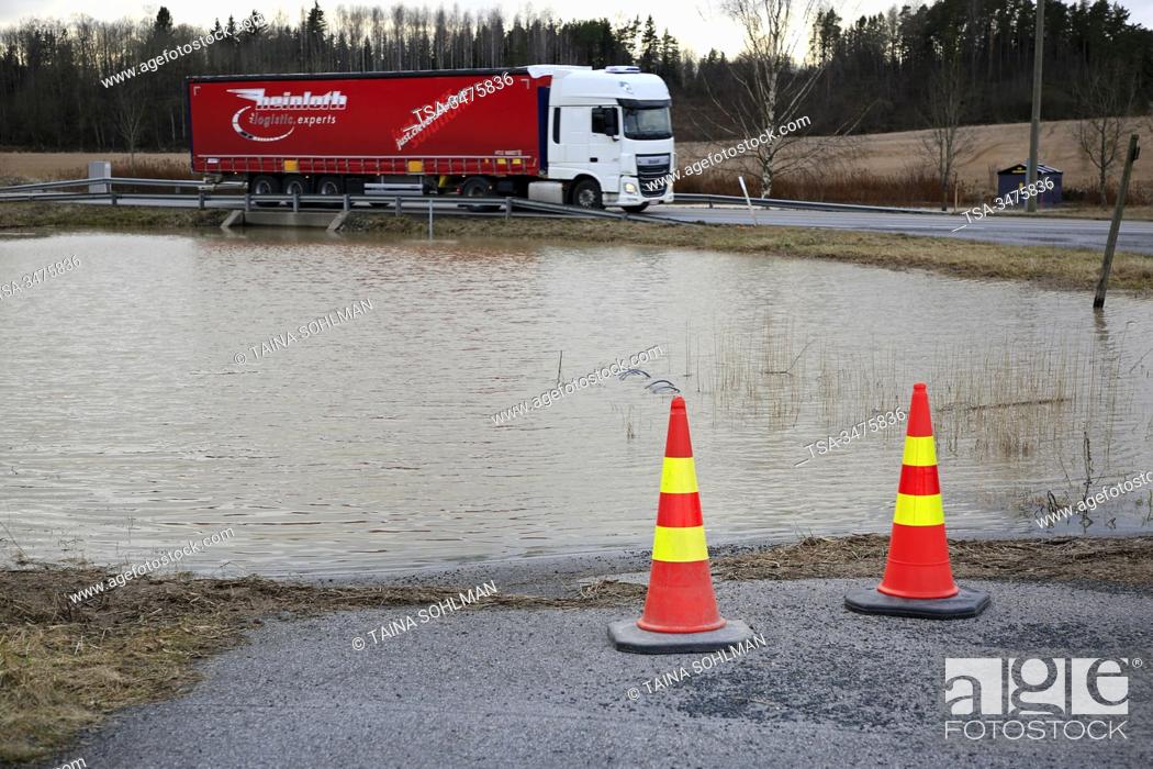 Stock Photo: Pernion asema, Salo, Finland, February 23, 2020. Pernionjoki flooding into highway 52 underpass, almost reaching the road.