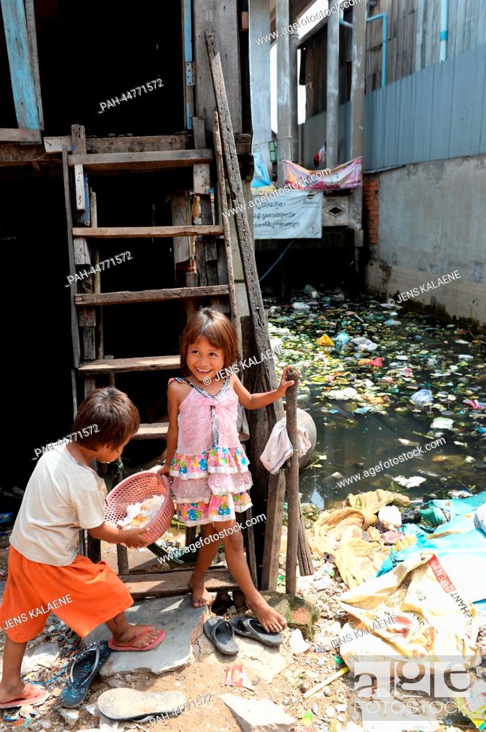 The girl Srey Mao (5) is pictured in front of her house in the Chhba Anmpov  Slum on the grounds of a..., Stock Photo, Picture And Rights Managed Image.  Pic. PAH-44771572 | agefotostock