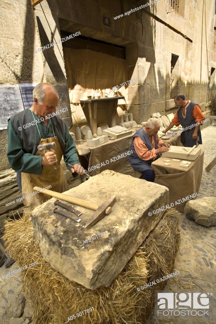 Stock Photo: Stonemason. Historical reenactment of the life of a Castilian town in the 14th century. Medieval Festival. Briones. La Rioja. Spain.