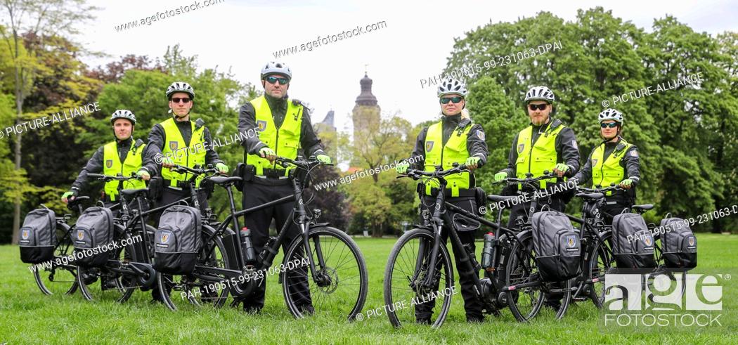 Stock Photo: 15 May 2019, Saxony, Leipzig: The officials of the new bicycle squadron of the Ordnungsamt Leipzig stand with bicycles in the Johannapark.