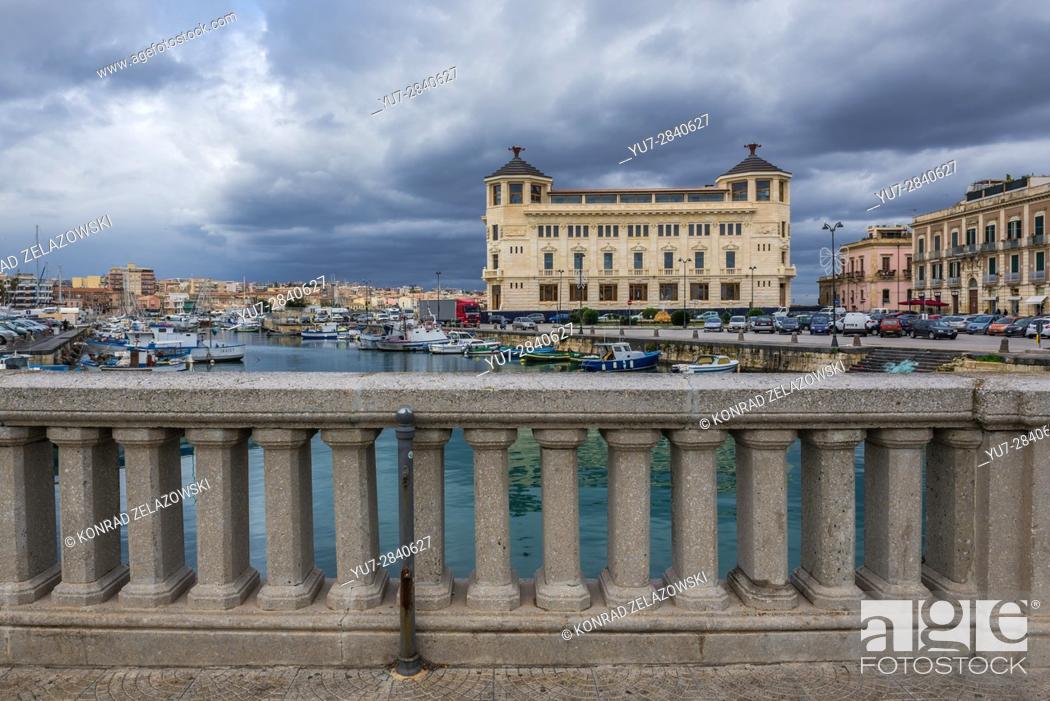 Stock Photo: Old Post Office building seen from Umbertino Bridge (Ponte Umbertino) connected mainland with Ortygia Island, old part of Syracuse city, Sicily, Italy.