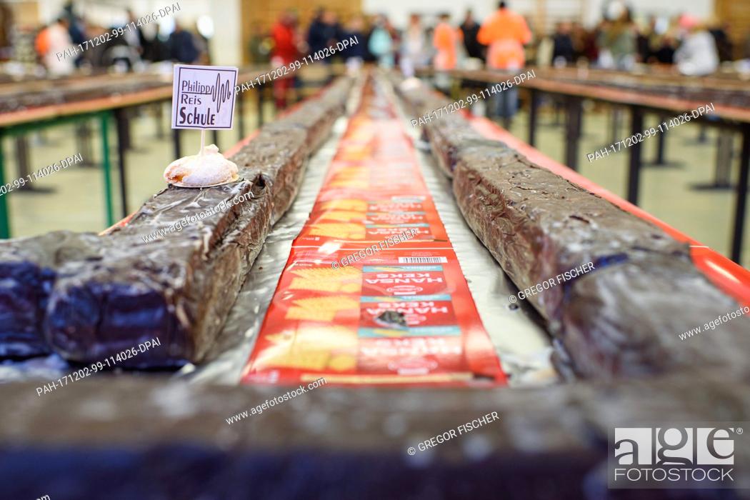 Stock Photo: A giant ""hedgehog slice"" measuring 734, 8 metres and weighing 2034 kg in a gymnasium during an attempt at a world record in Berlin, Germany, 02 December 2017.