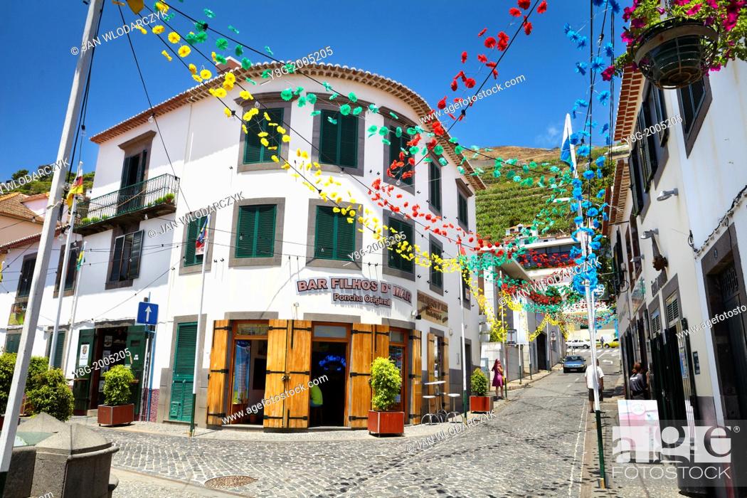 Stock Photo: Street decorated with paper flowers on feast of Madeira, Camara de Lobos, Madeira, Portugal.