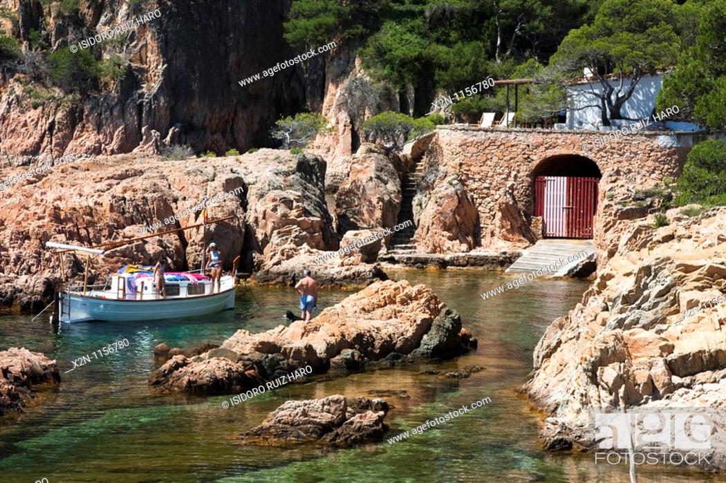 Stock Photo: Traditional fishing boat and hut in Aigua Xelida cove Costa Brava Baix Empordà Catalunya Spain.