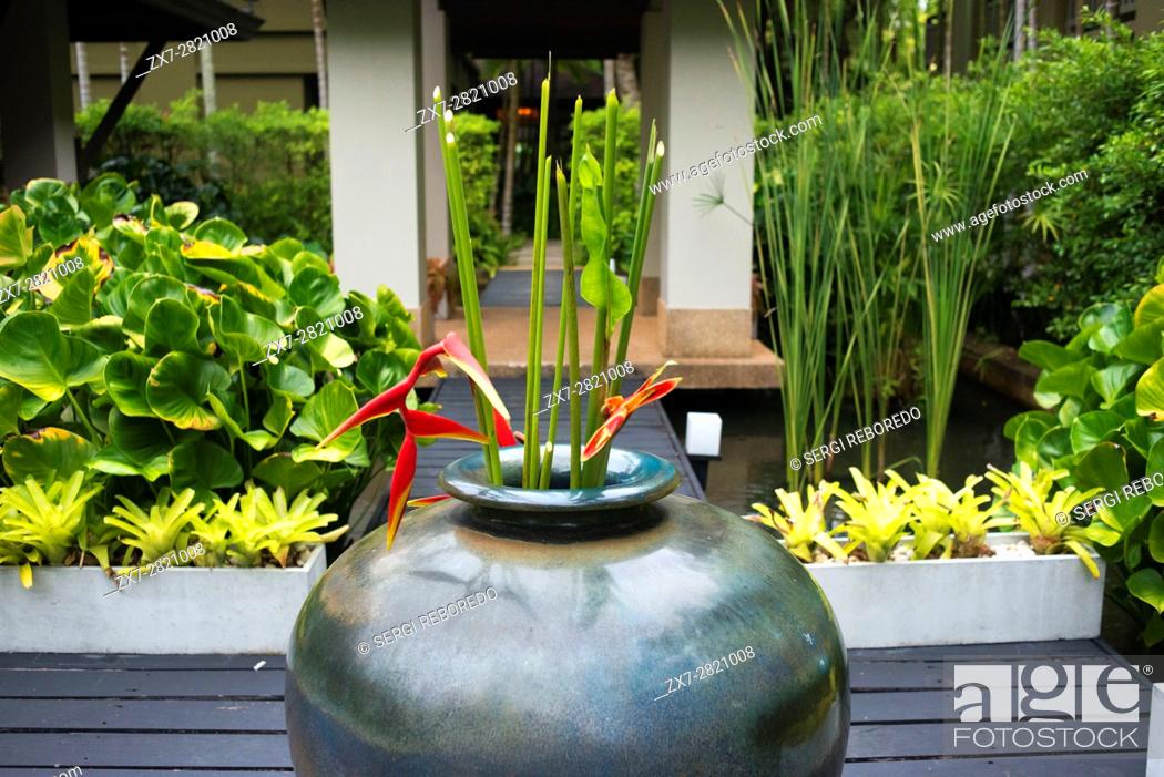 Stock Photo: Vase with flowers in the garden in the spa of Anantara Si Kao Resort & Spa, south of Krabi, Thailand. Located on the soft white sands of Changlang Beach.