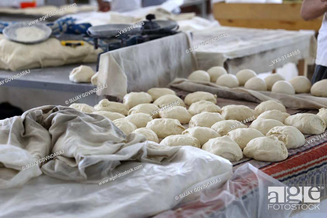 Stock Photo: Tashkent, Uzbekistan - May 01, 2017: Wheat dough prepared to make bread in a local hotel.
